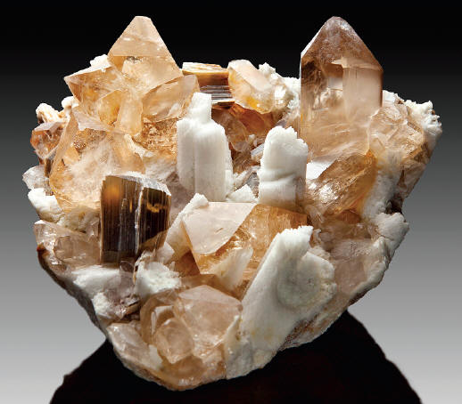 Topaz with quartz, muscovite and feldspar, 15 cm. Fine Minerals Intl. specimen. FMI-J. Elliott photo.