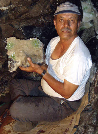 Fasi Makki with freshly collected specimen of stilbite with apophyllite “disco balls” inside the pcoket. S Makki photo.