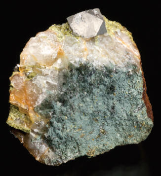 Sperrylite crystal in quartz-epidote matrix, specimen 4 cm wide. Wallbridge specimen. M. Bainbridge photo.