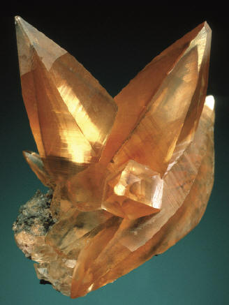 Calcite crystal on matrix, 3.3 cm high. P. Lyckberg specimen. J. Scovil photo